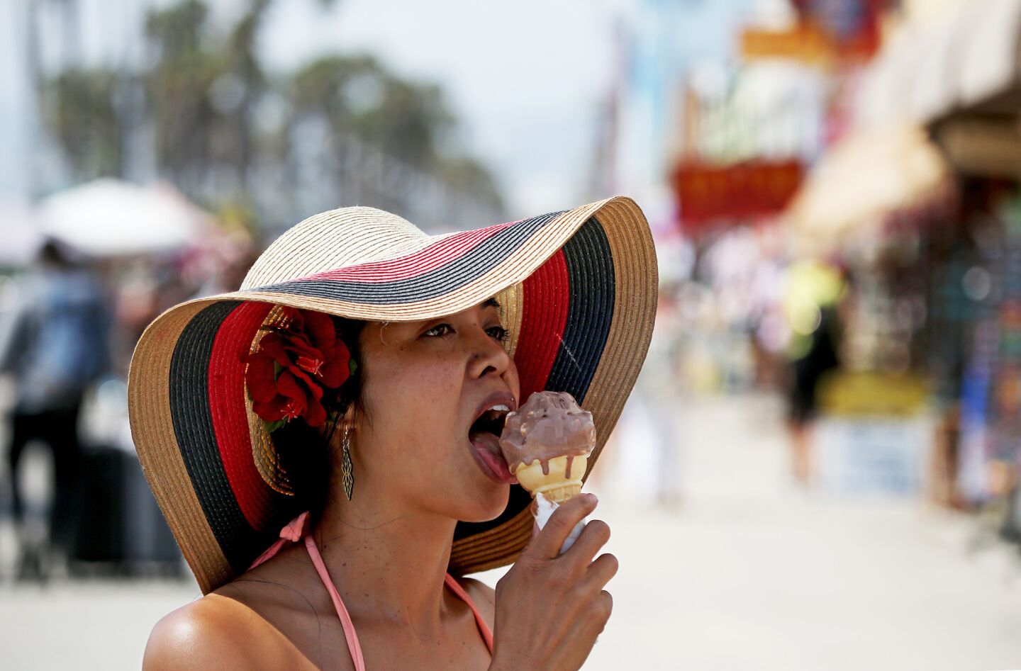 Jasmine Ejan cools off with a cone of chocolate ice cream on a warm afternoon in Venice Beach.