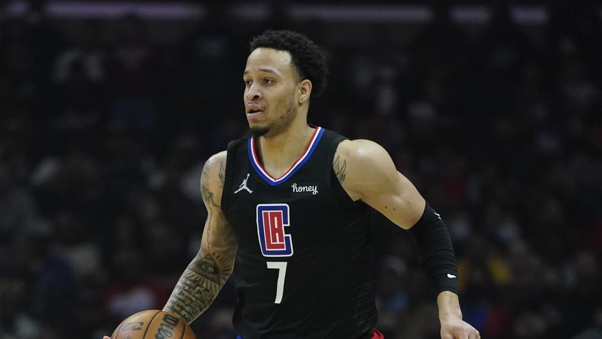 Clippers guard Amir Coffey controls the ball during the first half against the Toronto Raptors.