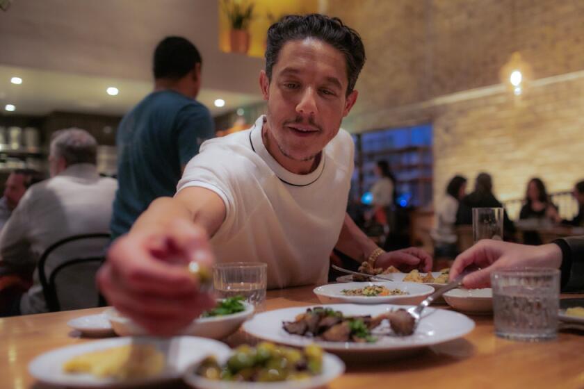 LOS ANGELES, CA - FEBRUARY 13: Actor Theo Rossi enjoys some olives at Bavel  restaurant