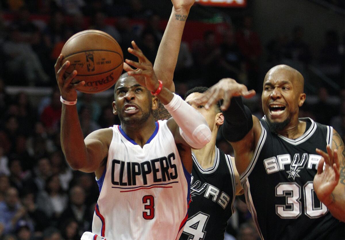 Los Angeles Clippers guard Chris Paul drives to the basket against San Antonio Spurs forward David West (30) in the fourth quarter on Feb. 18.