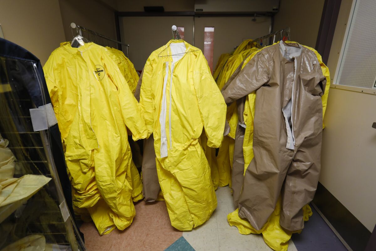PPE suits hang ready in the ER at El Centro Regional Medical Center.