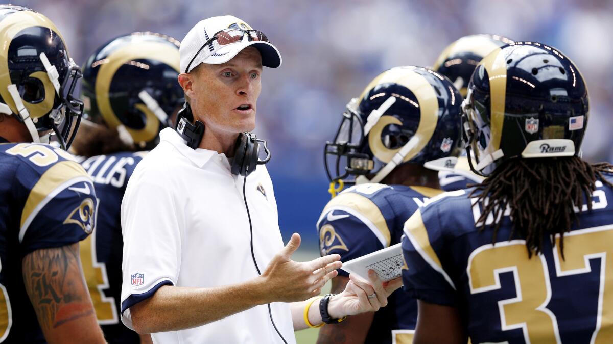 Rams special teams coach John Fassel talks to his players.