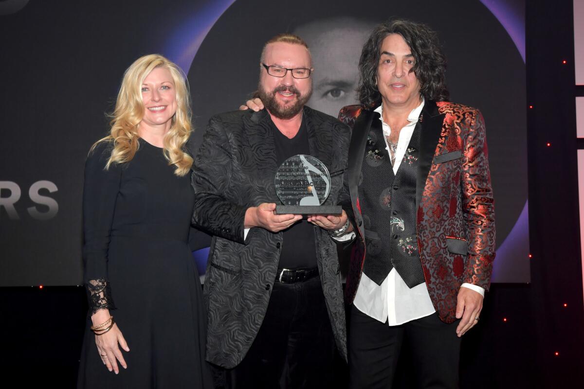 ASCAP Chief Executive Beth Matthews, from left, Desmond Child and Paul Stanley at the 35th annual ASCAP Pop Music Awards.