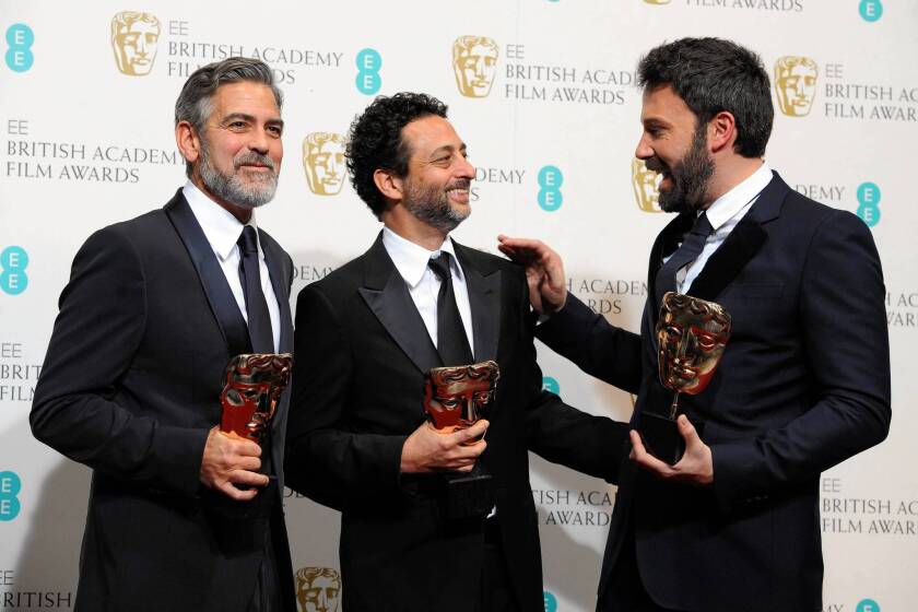 "Argo" producers George Clooney, left and Grant Heslov and director Ben Affleck after winning the BAFTA for best film.