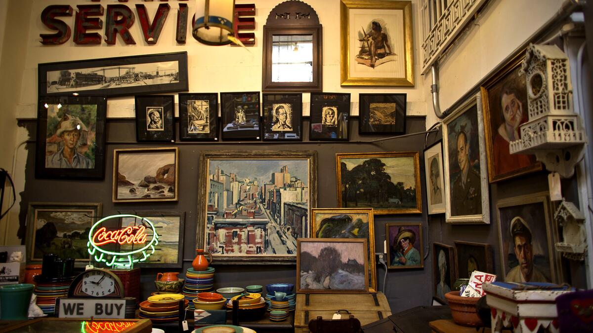 Oil-based paintings and other items at Eric Berg's Early California Antiques on Melrose Avenue.