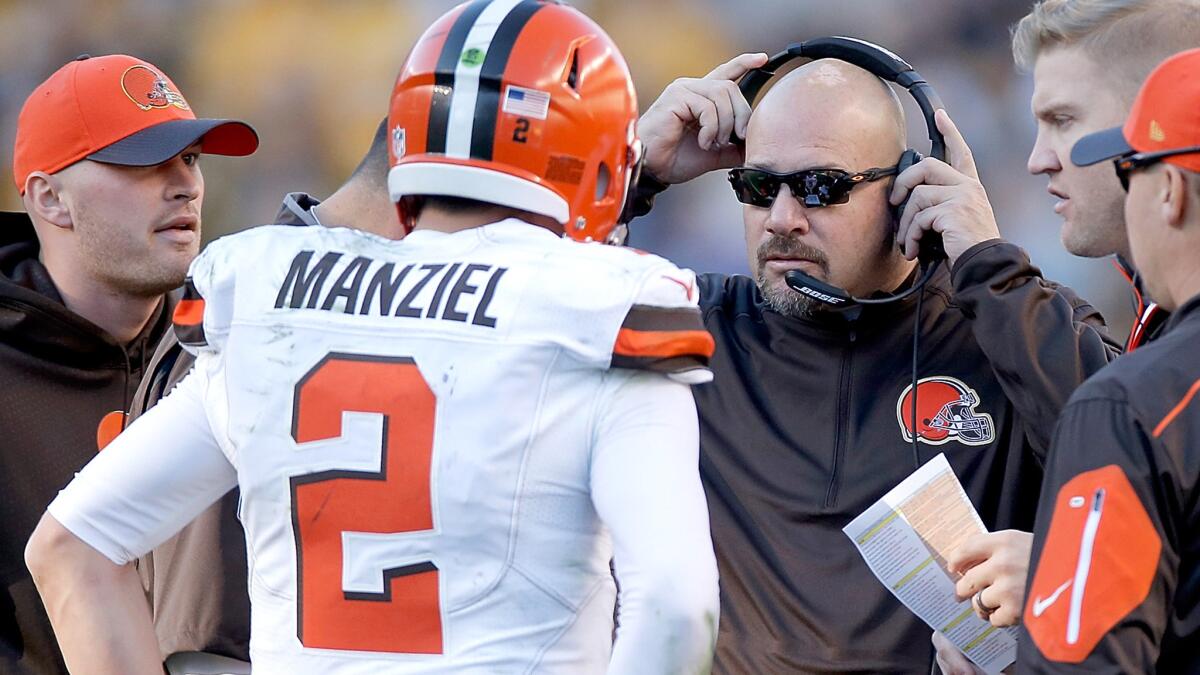 Browns Coach Mike Pettine (wearing headset) talks to quarterback Johnny Manziel during a game against the Steelers on Nov. 15.