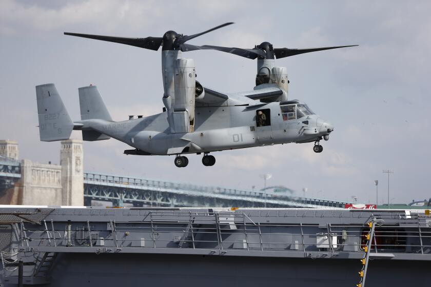FILE - A Marines Osprey lands aboard the USS Somerset, Feb. 27, 2014, in Philadelphia. A congressional oversight committee has launched an investigation into the V-22 Osprey program following the latest deadly crash, which killed eight Air Force special operations service members. The entire Osprey fleet remains grounded following the crash, with the exception of some limited Marine Corps flights. (AP Photo/Matt Rourke, File)