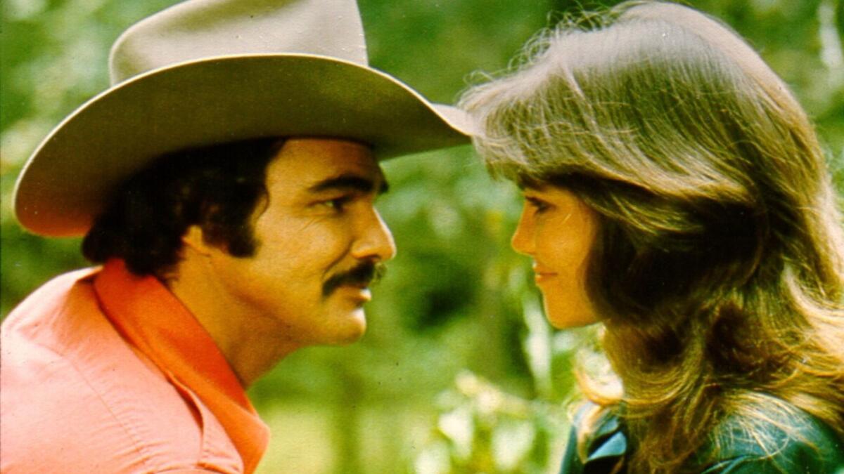 Burt Reynolds, here with Sally Field, developed a mischievous, self-deprecating persona evident in many of today's younger stars.