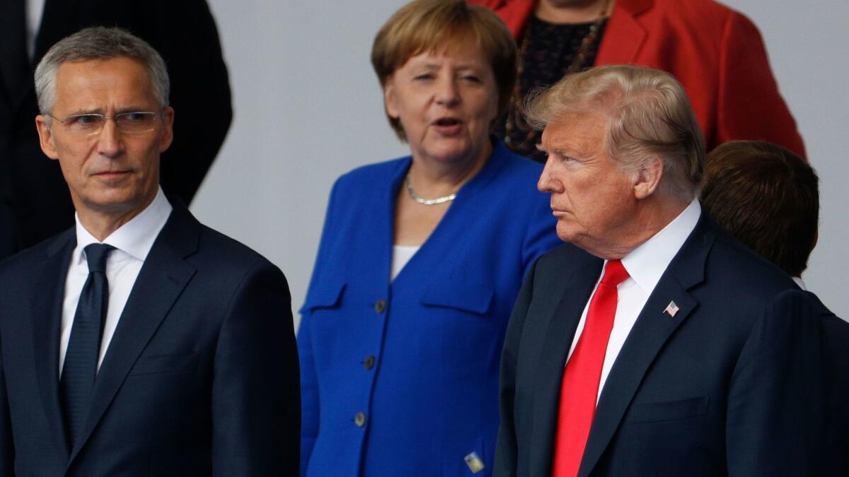 NATO Secretary-General Jens Stoltenberg, German Chancellor Angela Merkel and President Trump at the "family photo" session ahead of the opening ceremony of the NATO summit in Brussels.