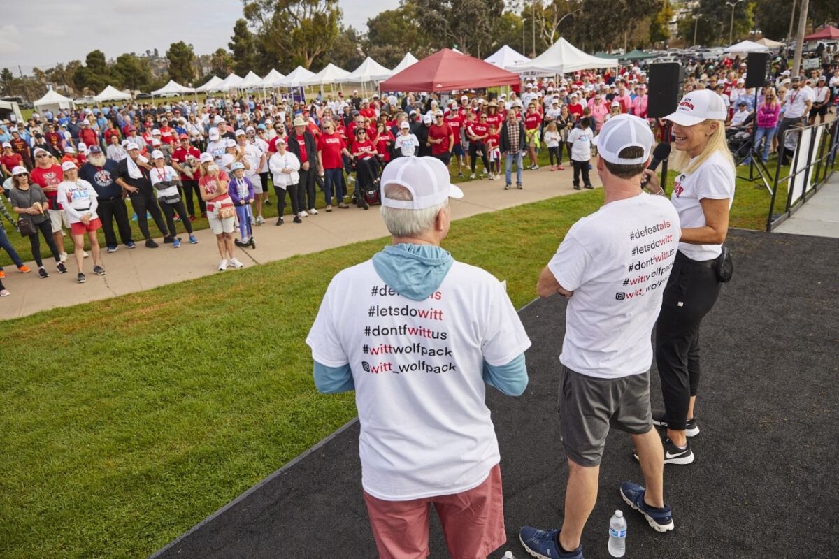 La Jollans Ed, Todd and Betsy Witt address participants in the San Diego Walk to Defeat ALS on Oct. 16.
