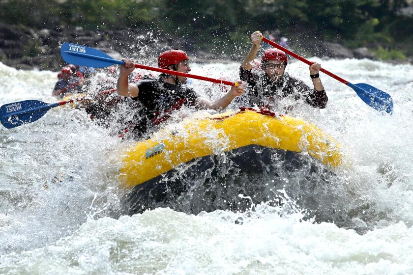 Rafters paddle through whitewater on the Upper Ocoee River, Saturday, July 24, 2021, near Ducktown, Tenn. These rapids on the Ocoee River were used for the canoe slalom in the 1996 Summer Olympic Games in Atlanta. (AP Photo/Ben Margot)