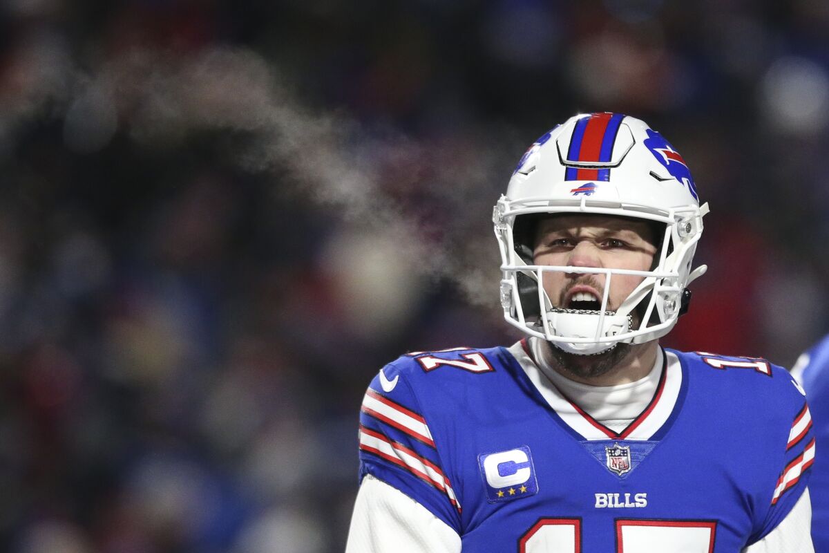 Buffalo Bills quarterback Josh Allen reacts after tight end Dawson Knox scores a touchdown during the first half of an NFL wild-card playoff football game against the New England Patriots, Saturday, Jan. 15, 2022, in Orchard Park, N.Y. (AP Photo/Joshua Bessex)