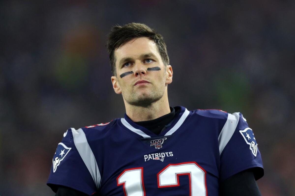FOXBOROUGH, MASSACHUSETTS - JANUARY 04: Tom Brady #12 of the New England Patriots looks on from the sideline during the the AFC Wild Card Playoff game against the Tennessee Titans at Gillette Stadium on January 04, 2020 in Foxborough, Massachusetts. (Photo by Maddie Meyer/Getty Images)