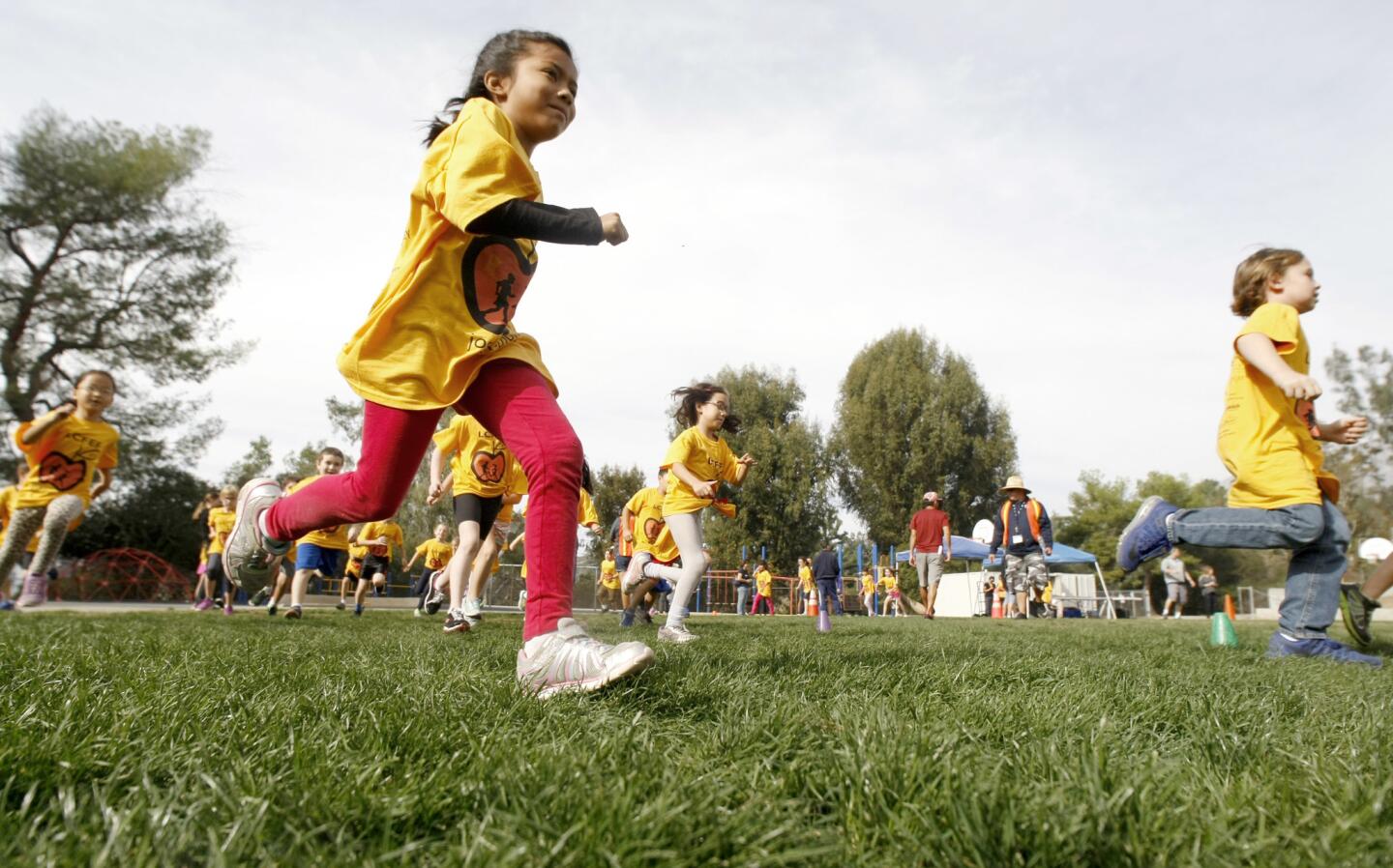 Second grader Julie Rodriguez participates in the annual La Ca–ada Flintridge Educational Foundation Jog-a-thon at Palm Crest Elementary School in La Ca–ada Flintridge on Wednesday, Nov. 16, 2016. Funds raised go to the Annual Fund, which helps fund drama, art and music classes along with class size reduction and counselor, among other things.