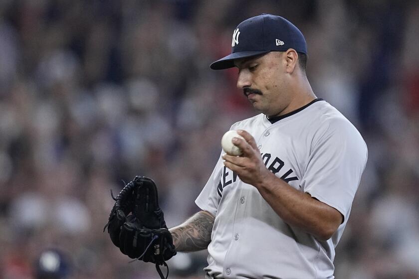 New York Yankees starting pitcher Nestor Cortes reacts after giving up a two-run single to Houston Astros' Chas McCormick during the first inning of a baseball game, Thursday, March 28, 2024, in Houston. (AP Photo/Kevin M. Cox)