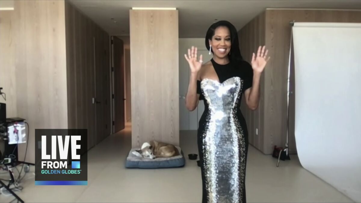 Regina King shows off her gown during the 78th Golden Globes telecast. 