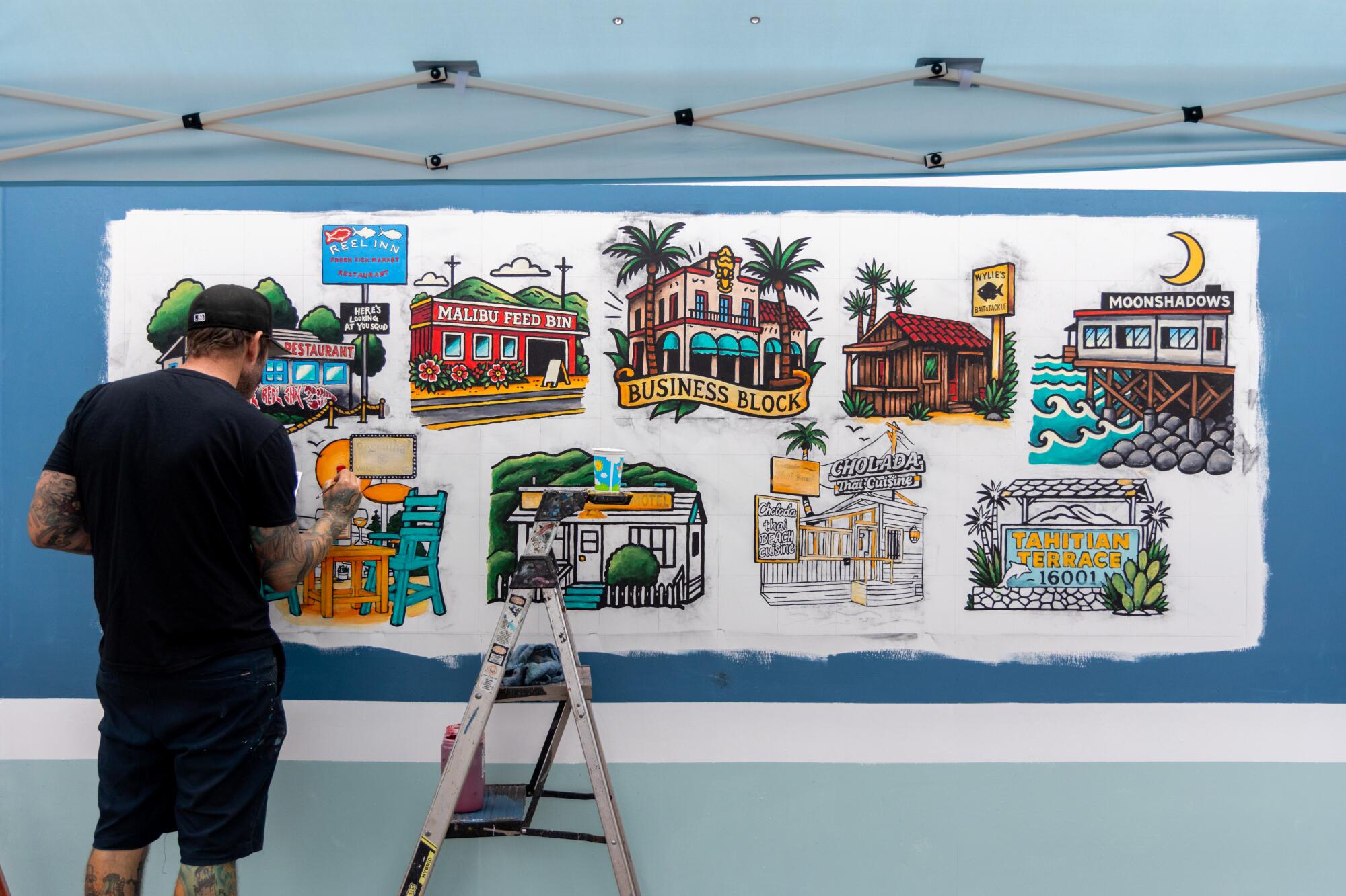 Muralist Jonas Never paints local businesses lost in the Palisades fire at Gladstone's Malibu.