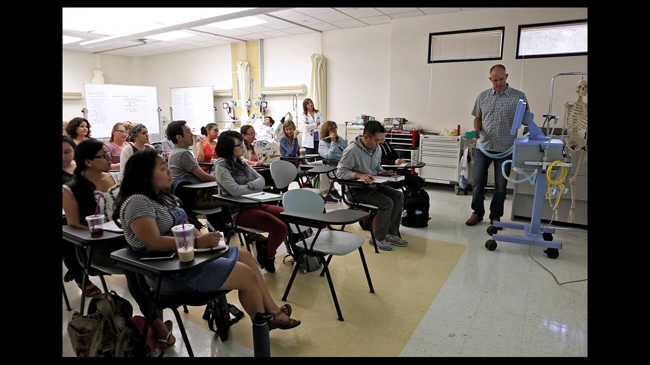 Guest presenter and White Memorial Hospital Respiratory Manager Drew Martenson, right, teaches the Ventilator Competency class, at the Critical Care Continuing Education Course, at Glendale Community College on Wednesday, July 11 2018. The course, held on the main campus of the college, is for registered nurses and runs for eight weeks.