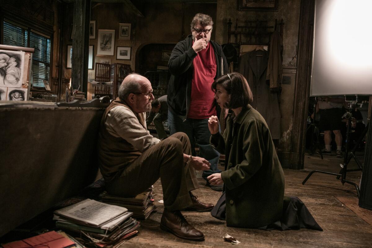 Director Guillermo del Toro, center, on the set with "The Shape of Water" stars Richard Jenkins and Sally Hawkins.