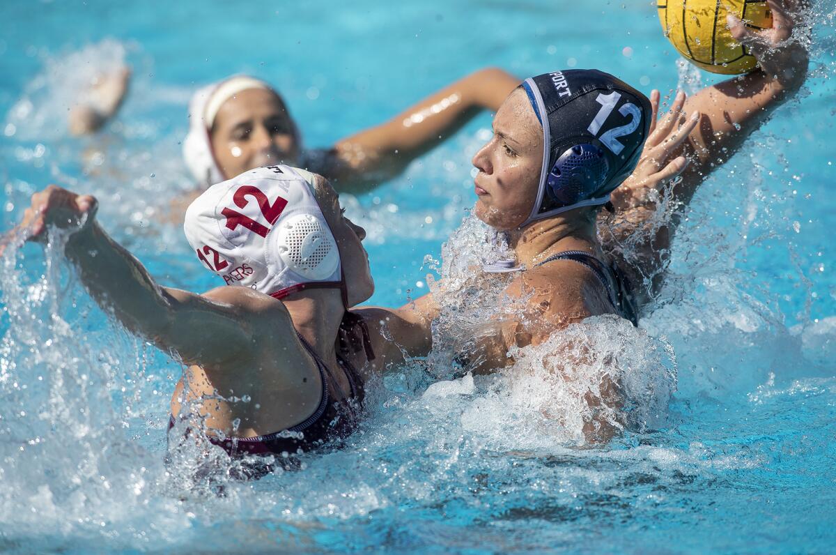 Newport Harbor's Bia Mantellato takes a shot against Laguna Beach's Ava Knepper during Saturday's match.