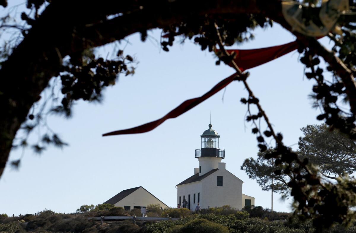The Old Point Loma Lighthouse will be lighted in purple and gold Aug. 21-23 and Aug. 26.