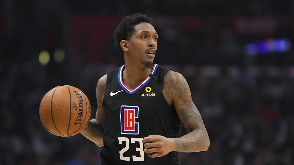 Clippers guard Lou Williams brings the ball up court during a game.