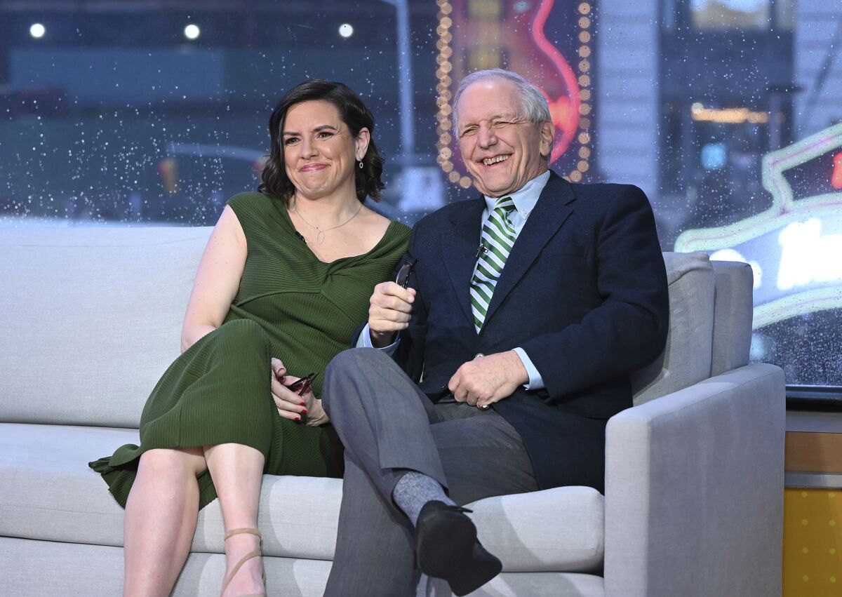 This image released by ABC shows retired ABC News journalist Charlie Gibson, right, with his daughter Kate Gibson on the set of "Good Morning America" in New York on Monday, May 2, 2022, to announce their literary podcast called "The Book Case." (Paula Lobo/ABC via AP)