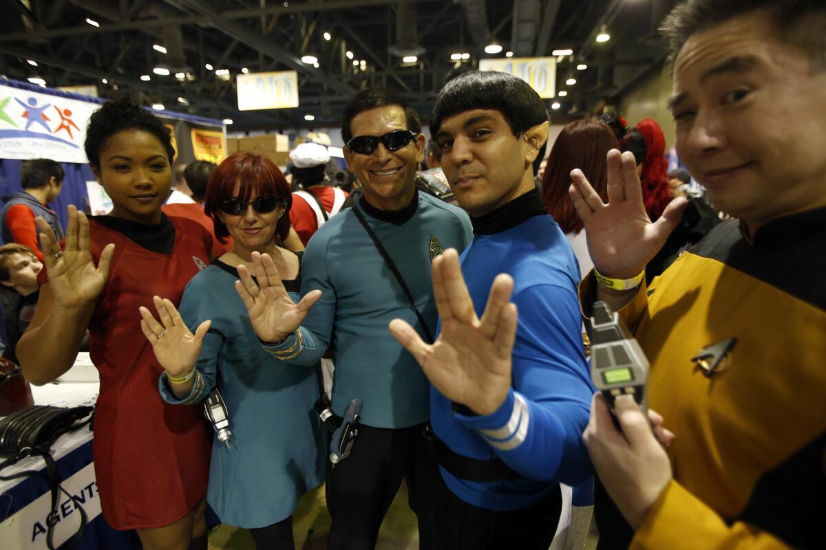 Mamie Stiger, left, Idalia Mejia, Alfredo Garcia Jr., Richard Casillas and Sywa Sung give the Vulcan salute in memory of actor Leonard Nimoy at the Long Beach Comic Expo at the Long Beach Convention Center. "I dressed like Spock," said Casillas. "It was something I had to do."