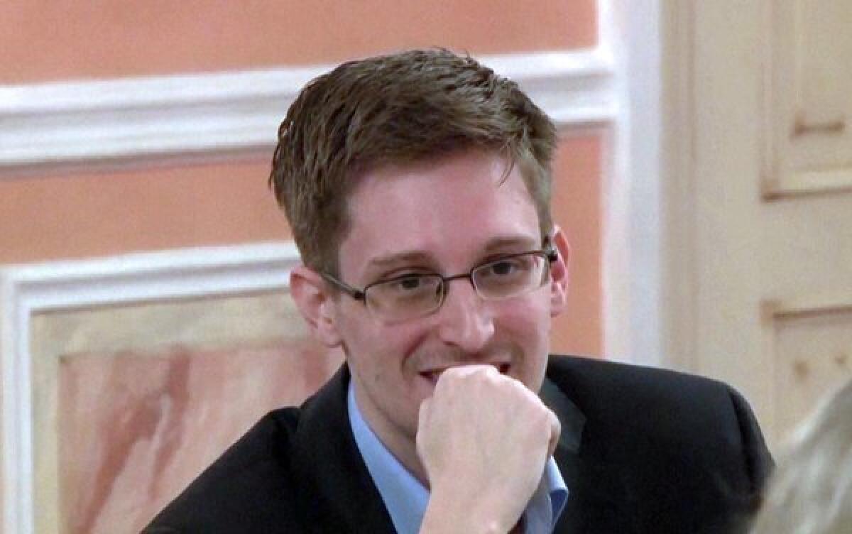 Fugitive NSA intelligence leaker Edward Snowden, shown in this image from a WikiLeaks video made on Oct. 12, is going back to work in data protection for a major Russian website.