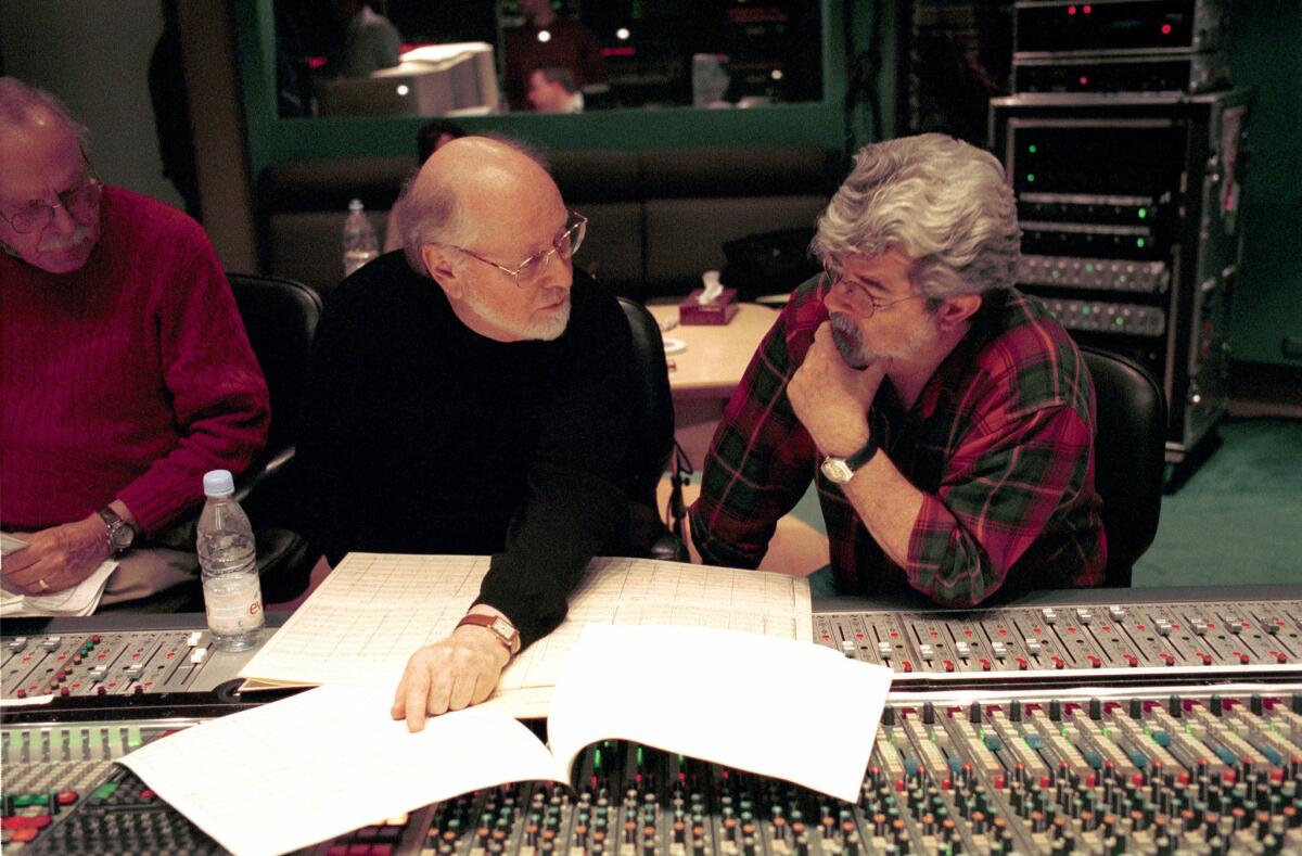 John Williams, center, consulting with George Lucas at London's Abbey Road studios in 2002.