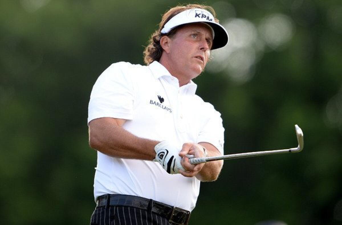 Phil Mickelson watches his tee shot at No. 9 during the second round of the U.S. Open on Friday at Merion Golf Club.