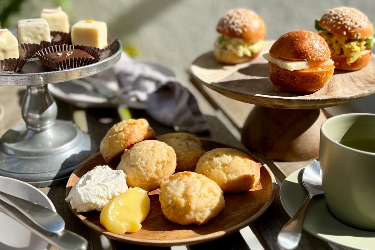 pastries on plates on an outdoor table 