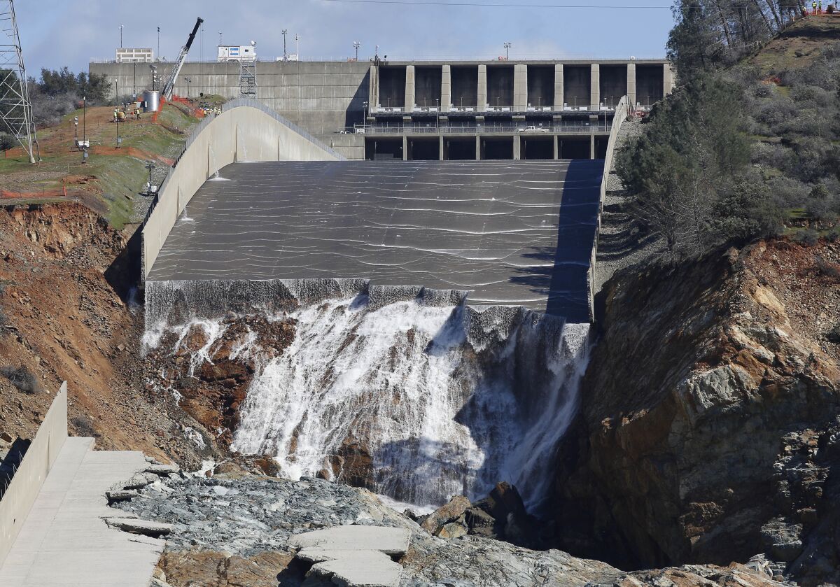 A small flow of water goes down Oroville Dam's crippled spillway on Feb. 28 in Oroville, Calif.