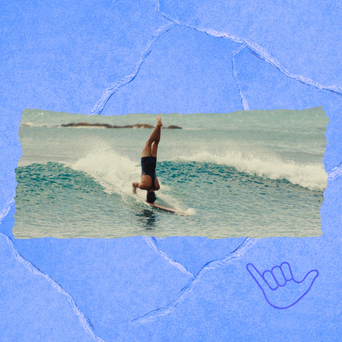 A man rides a wave in the ocean on a surfboard while doing a handstand.