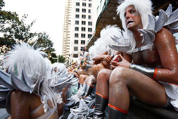 Participants entertain themselves before marching in the streets during the annual Sydney Gay and Lesbian Mardi Gras Parade.