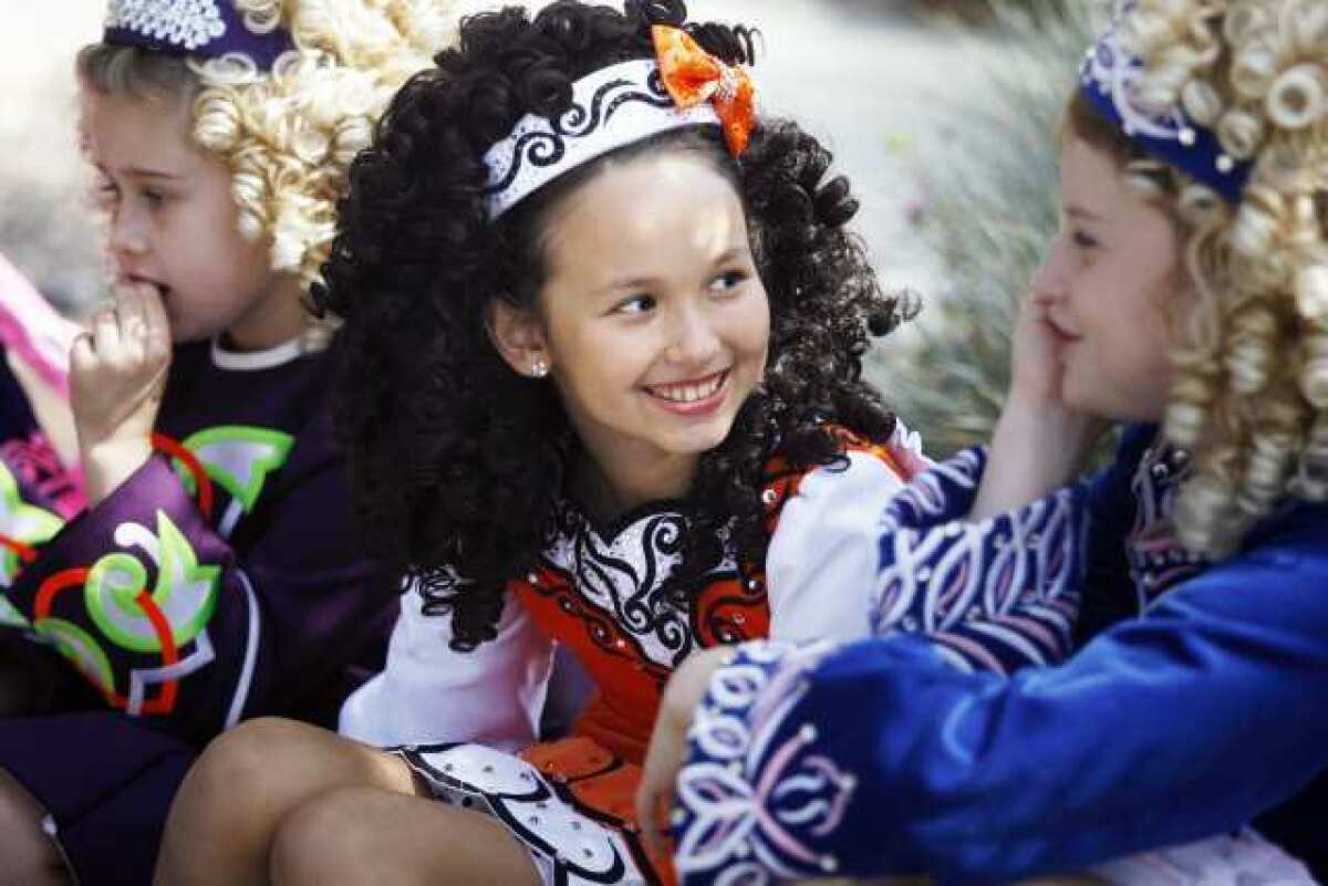 Meehan Kono, 10, center, talks to Savannah Robinson, 11, right, before participating in Burbank on Parade, which took place on Olive Avenue, between Keystone and Lomita streets, in Burbank on Saturday, April 6, 2013.