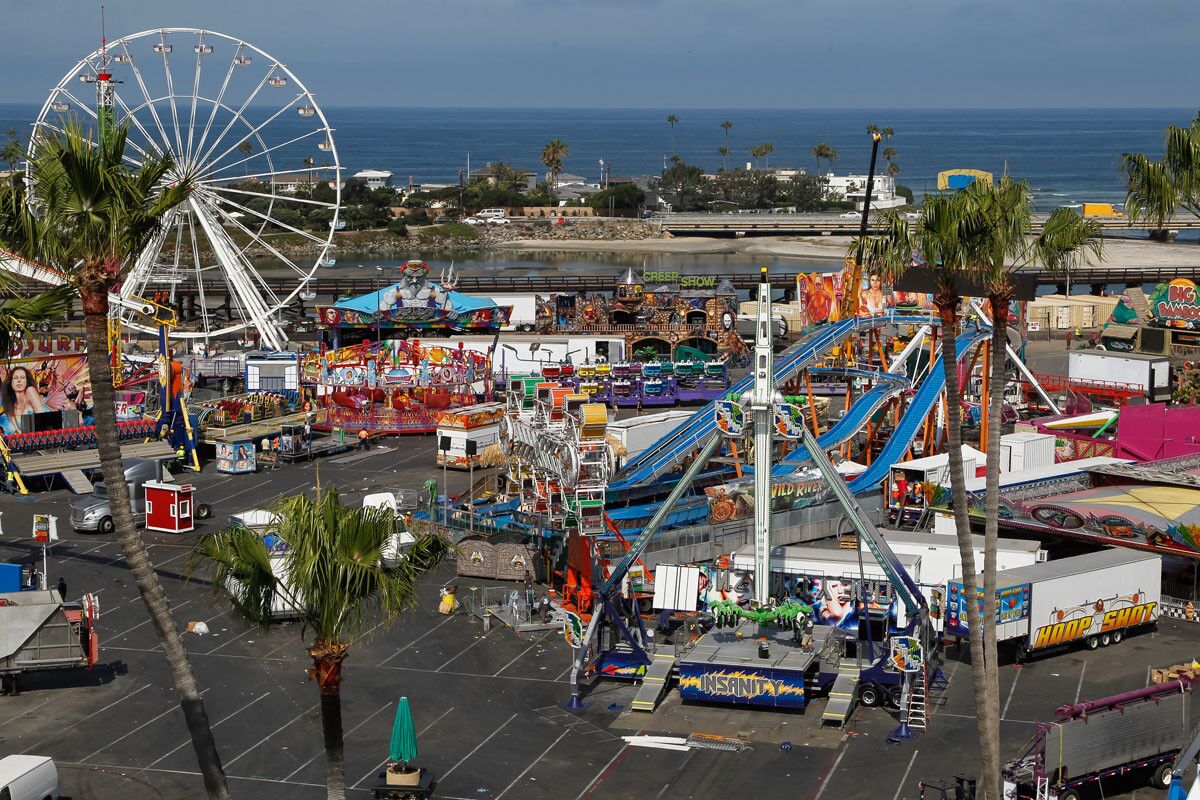 Crews disassemble rides on Wednesday after the last day of the San Diego County Fair. (Eduardo Contreras/Union-Tribune)