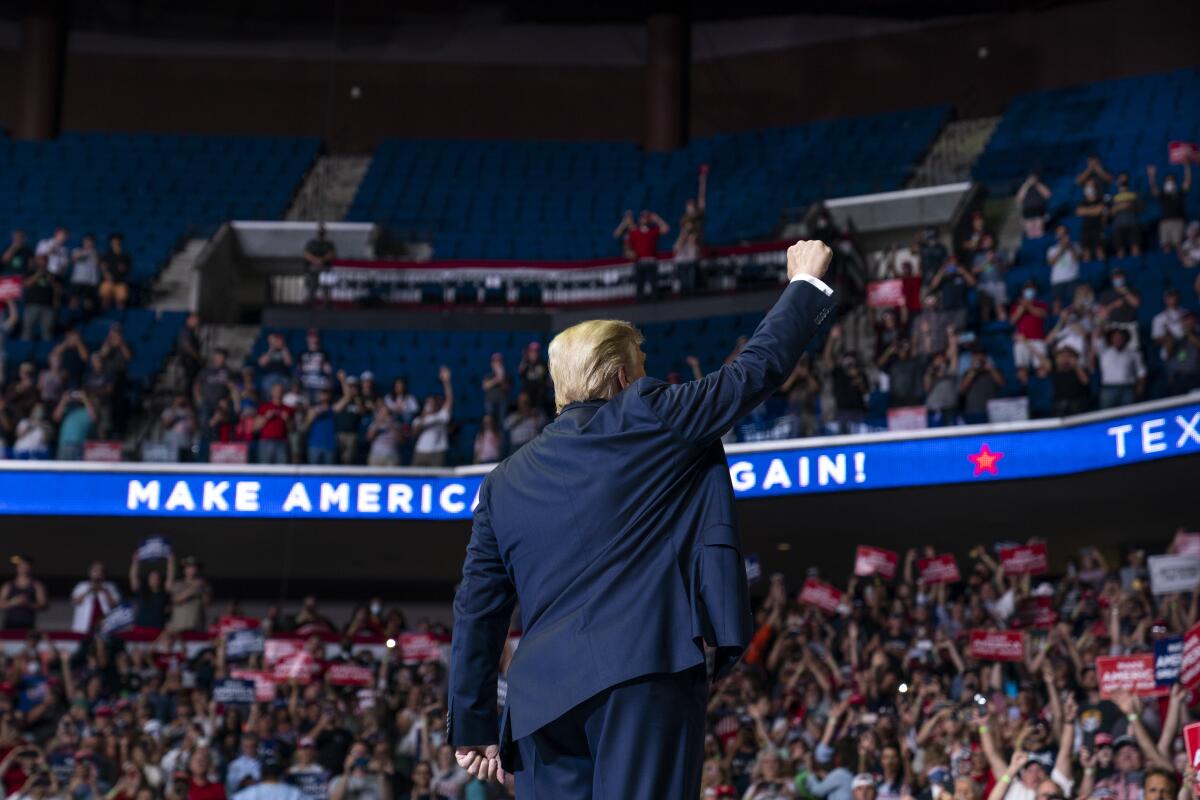 President Trump raises his fist during a campaign rally in Tulsa, Okla., on June 20, 2020.