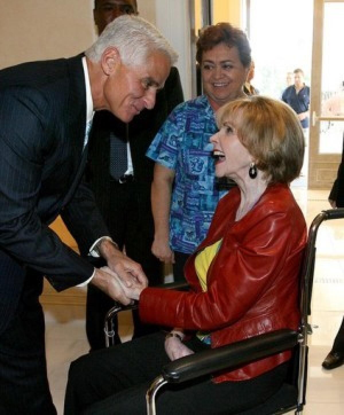 Paula Hawkins greets Florida Gov. Charlie Crist at an event in Orlando in October. As a U.S. senator in the 1980s, Hawkins helped pass the Missing Children Act and revealed at a Congressional hearing that she had been molested as a child.