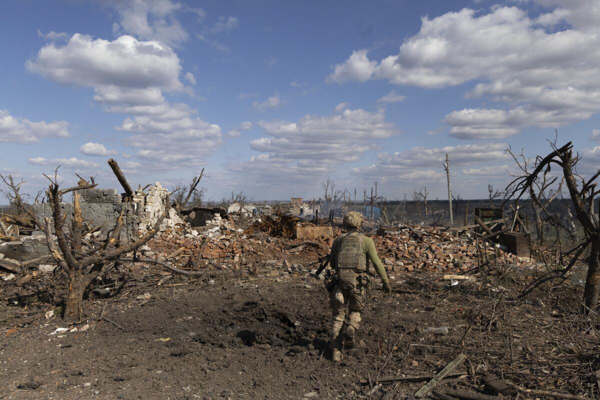 Ukrainian unit commander running to his position on the front line in Andriivka, Ukraine