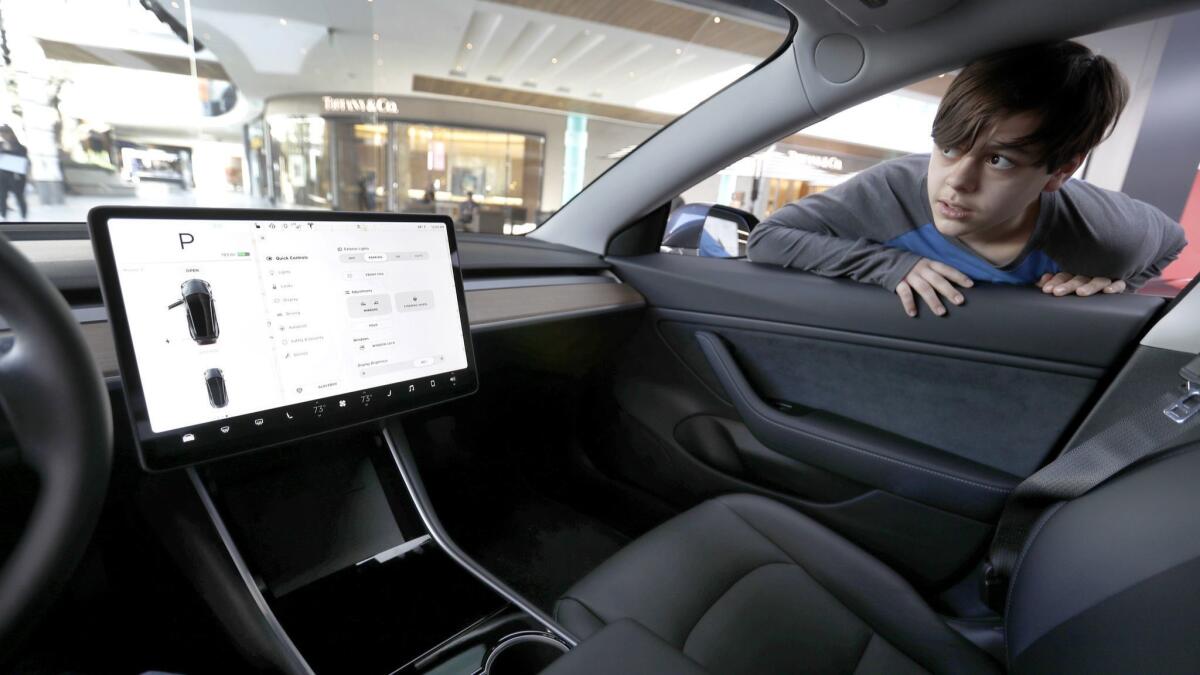 The touchscreen-based dashboard in a Tesla Model 3.