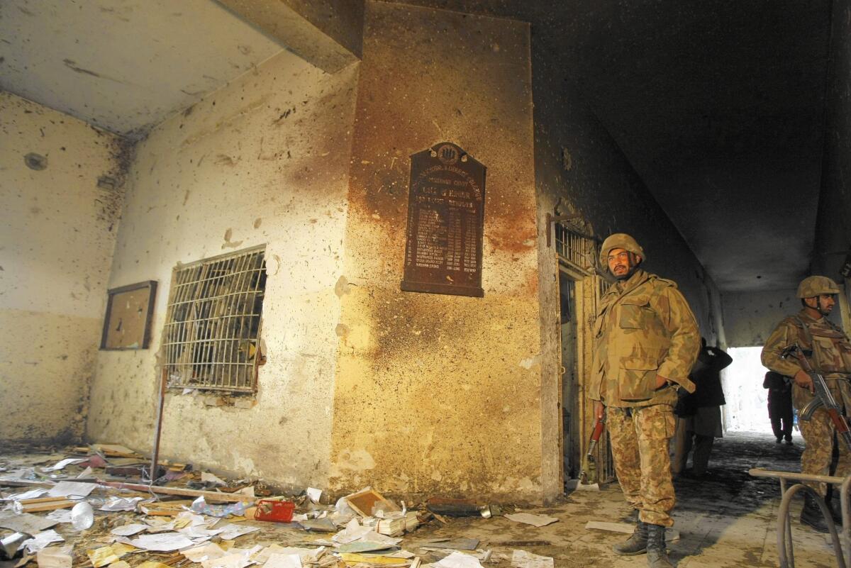 Soldiers inspect the Army Public School in Peshawar, Pakistan, on Dec. 17, a day after Pakistani Taliban militants killed 132 students and 16 staff members there. Reporter Zulfiqar Ali and his wife and two children live less than a mile from the school.