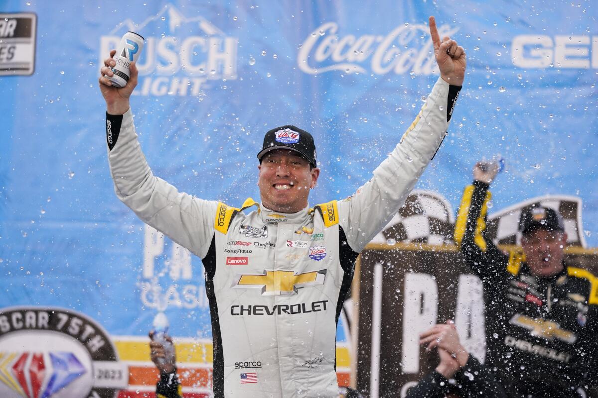 Kyle Busch celebrates after winning a NASCAR Cup Series auto race at Auto Club Speedway in Fontana.