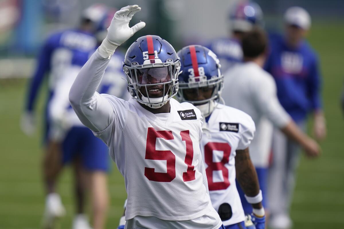 FILE - New York Giants' Azeez Ojulari participates in a practice at the NFL football team's training facility in East Rutherford, N.J., May 26, 2022. Ojulari passed his physical and practiced with the team Sunday, Aug. 14, 2022, for the first time since training camp opened. (AP Photo/Seth Wenig, File)