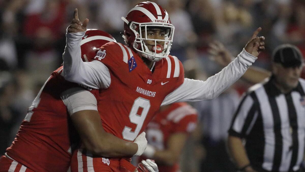 Mater Dei quarterback Bryce Young celebrates after scoring the winning touchdown against IMG Academy on Sept. 21.