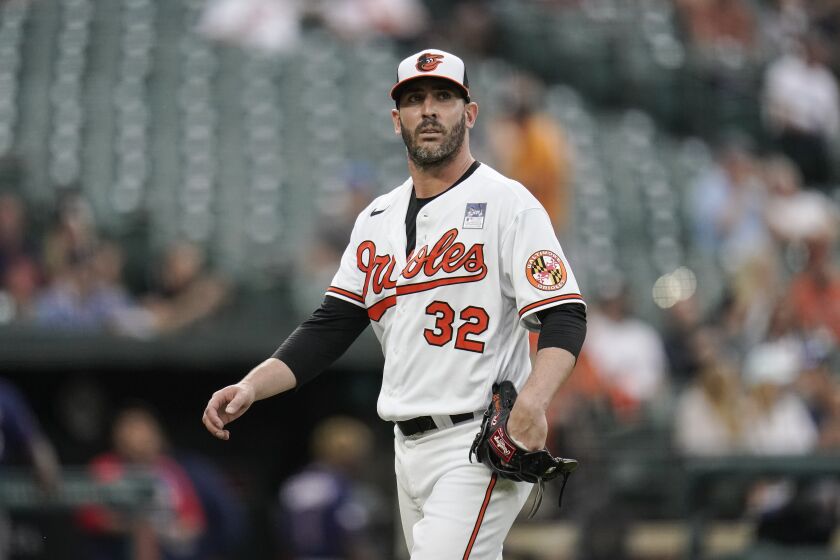 FILE - Baltimore Orioles starting pitcher Matt Harvey heads to the dugout after pitching to the Minnesota Twins in the second inning of a baseball game on June 2, 2021, in Baltimore. Harvey was suspended for 60 games by Major League Baseball on Tuesday, May 17, 2022, for distributing a prohibited drug of abuse. (AP Photo/Julio Cortez, File)
