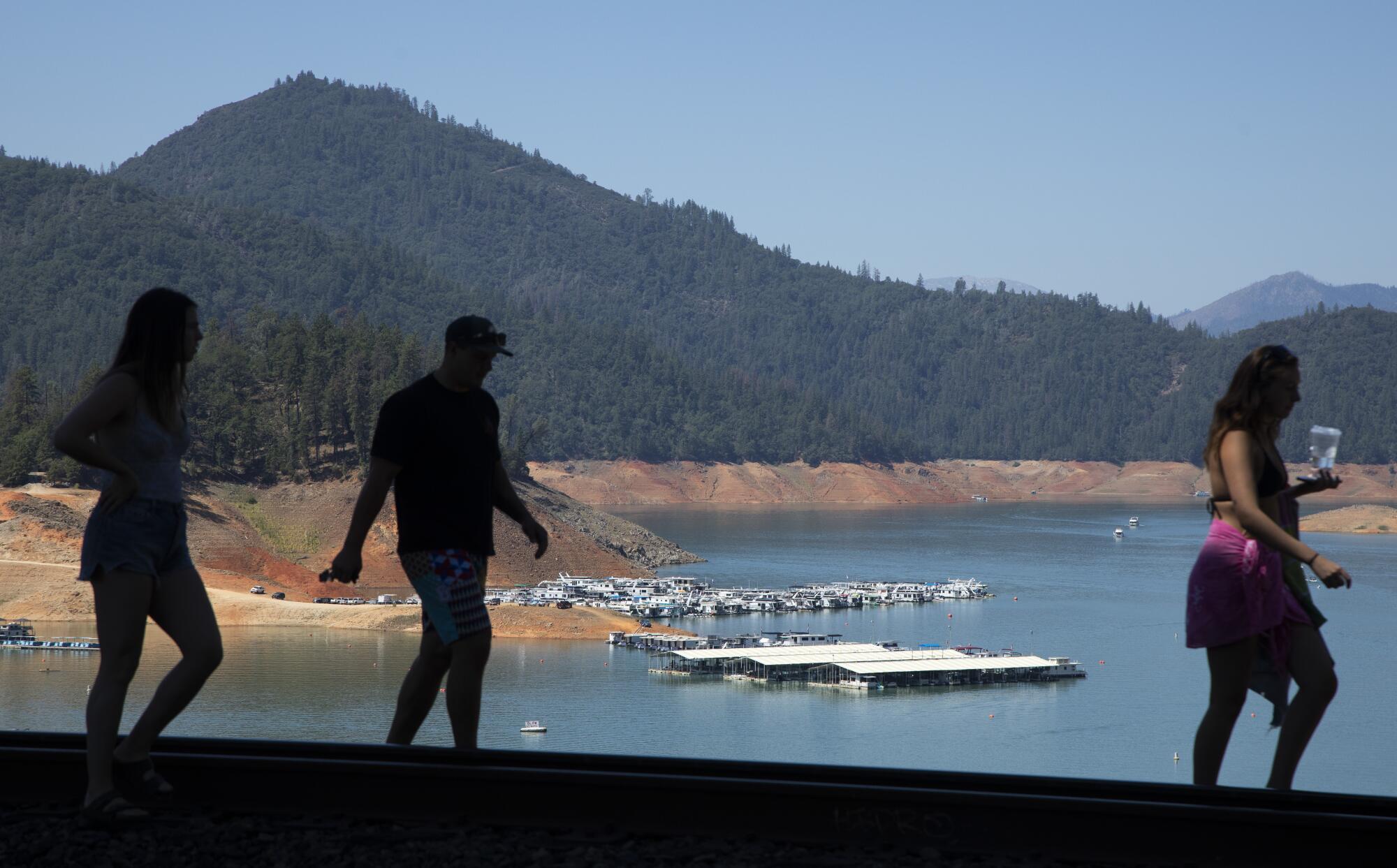 People enjoy the shores of Shasta Lake.