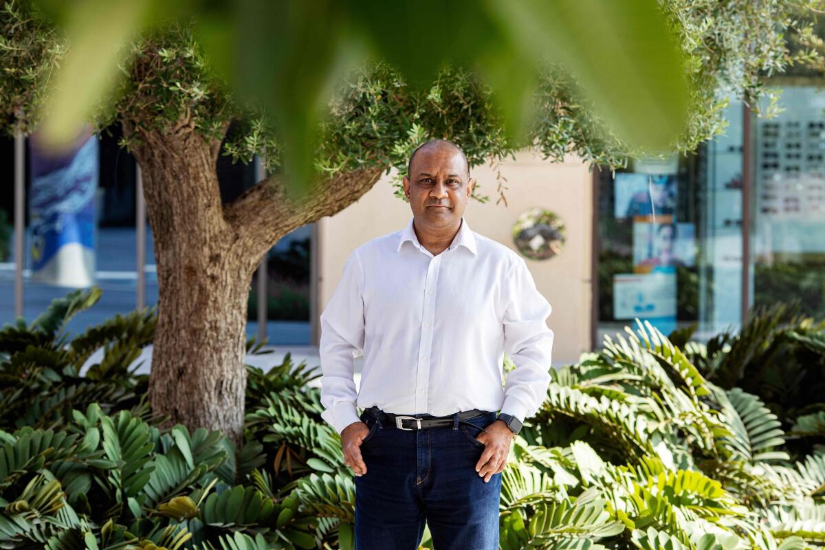 FILE - Sanjay Shah poses for a photograph on the Palm Jumeriah Island in Dubai, United Arab Emirates, Sept. 29, 2020. A lawyer for Shah, who was arrested in Dubai for allegedly masterminding a $1.7 billion tax scheme in Denmark, asked judges on Monday, Sept. 5, 2022, not to extradite Shah. He has maintained his innocence in the case. (AP Photo/Christopher Pike, File)