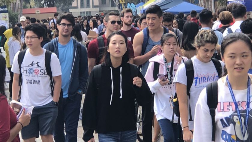 Crowds of students walking on the UC San Diego campus