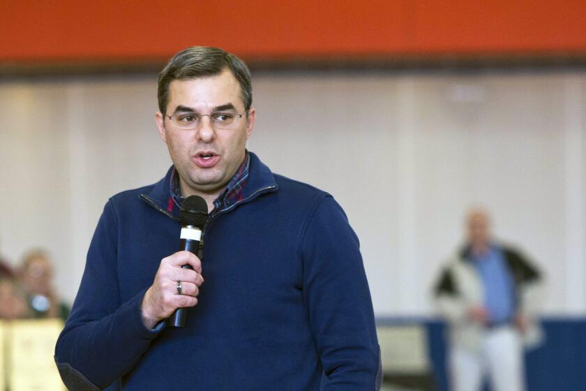 FILE - In this Thursday, Feb. 23, 2017 file photo, U.S Rep. Justin Amash, R-Cascade Township, speaks to the audience during a town hall meeting at the Full Blast Recreation Center in Battle Creek, Mich. Amash, a Republican congressman from Michigan says hes concluded that President Donald Trump has engaged in impeachable conduct. Congressman Justin Amash tweeted Saturday, May 18, 2019 that he has read the entire redacted version of special counsel Robert Muellers Russia report. (Carly Geraci//Kalamazoo Gazette via AP, File)